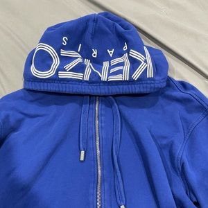 Fits more like a medium because it has put in the dryer, 100% authentic!